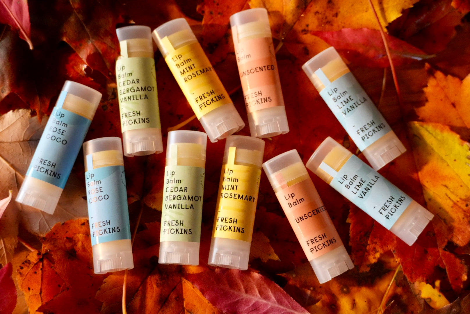 Fresh Pickins Lip Balms in the leaves