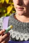 Farm Girl holding lip balm soft lips
