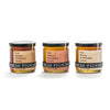 Three jars of honey from Fresh Pickins Farm in Maine on a white background