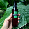 Using Fresh Pickins Farm bug and tick spray in the rainforest.
