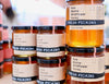 Fresh Pickins Farm Wildflower honey displayed at a Maine farmers market.