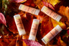 Lip Balms displaued amognst the autumn leaves