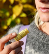 Person holding Fresh Pickins Farm Mint Rosemary at the farm