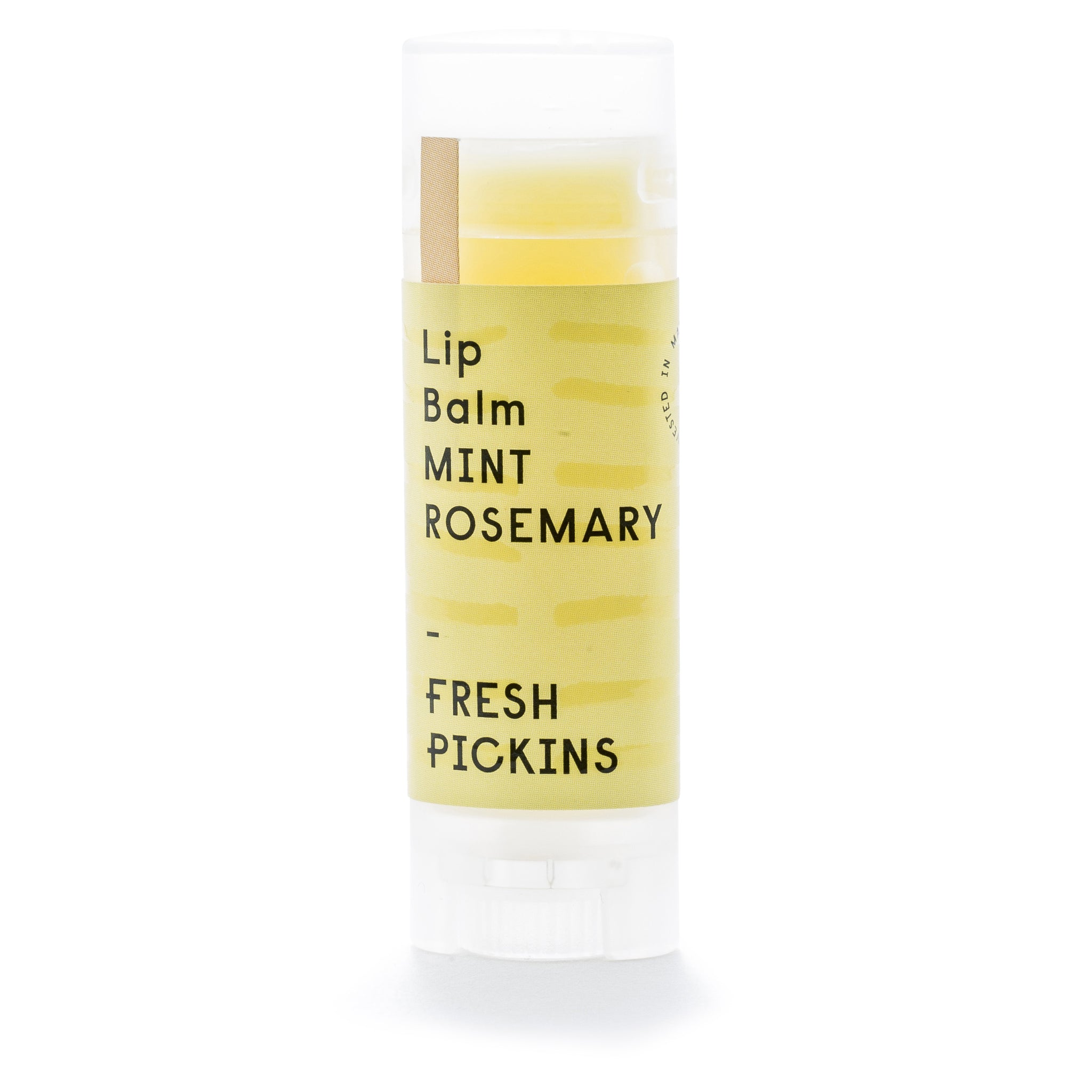 A stick of lip balm labeled 'Lip Balm Mint Rosemary' from Fresh Pickins.