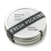 A metal tin container with a black label that reads 'WIPEOUT SORE MUSCLE BALM' and 'FRESH PICKINS'.